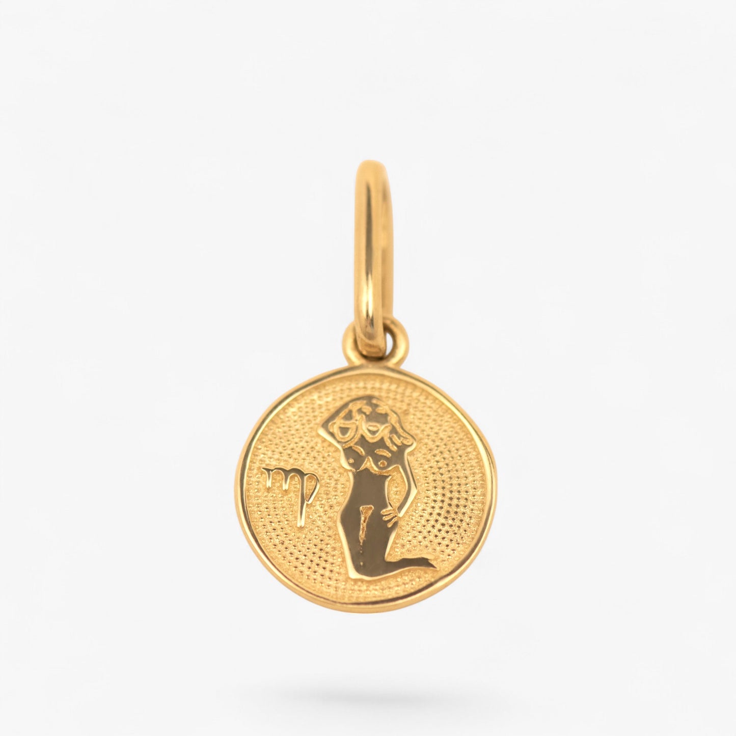 Pandantiv cu zodia fecioara din aur de 14k pe fundal alb. 14k solid gold
Virgo zodiac charm on a white background