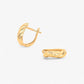 Cercei din aur 14k pe fundal alb Twisted Bond solid Gold hoop Earrings on white background